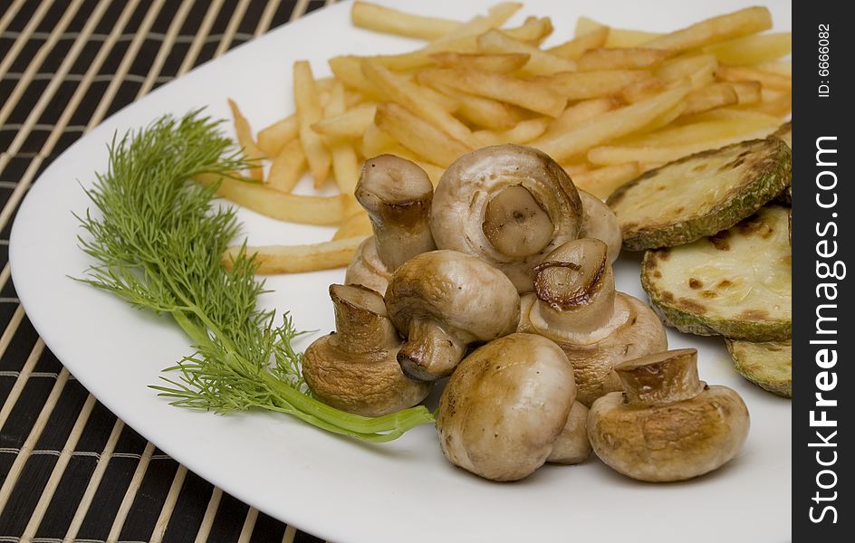 Tasty field mushrooms with a potato free and courgettes. Tasty field mushrooms with a potato free and courgettes