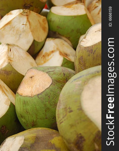 Image of green coconuts for sale.