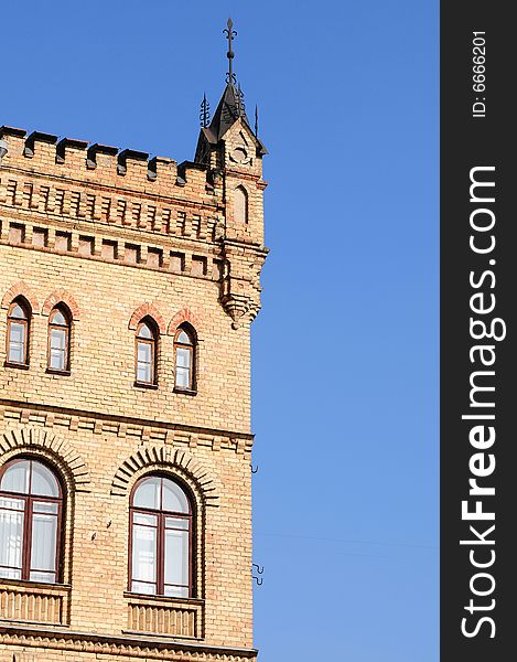 Old castle detail against blue sky.