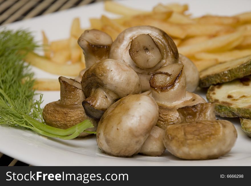 Tasty field mushrooms with a potato free, closeup. Tasty field mushrooms with a potato free, closeup