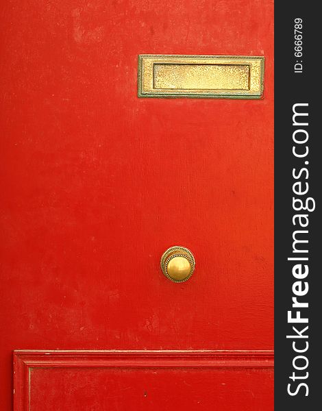 A portion of a red door