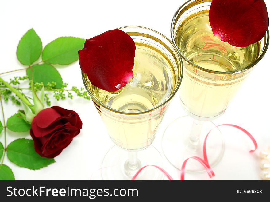 Two glasses with wine and roses