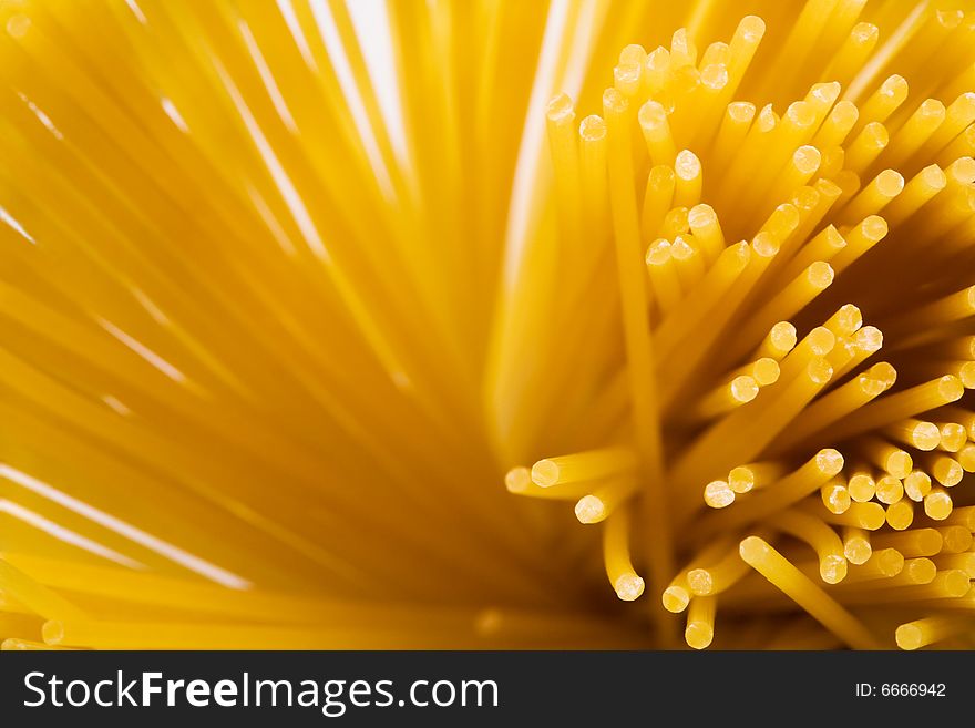 Yellow and beautiful pasta close-up as a background