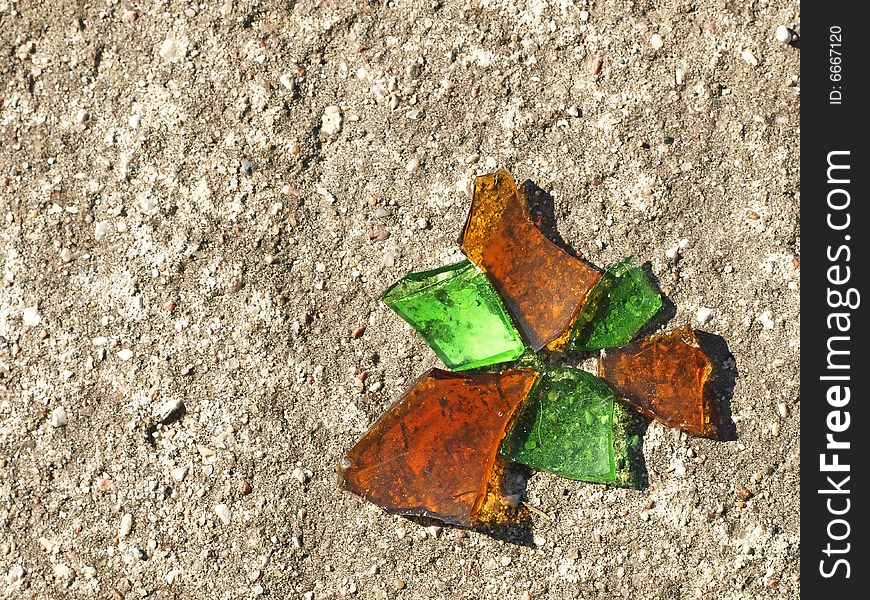 Orange And Green Glassy Chips Reminding Butterfly On Concrete