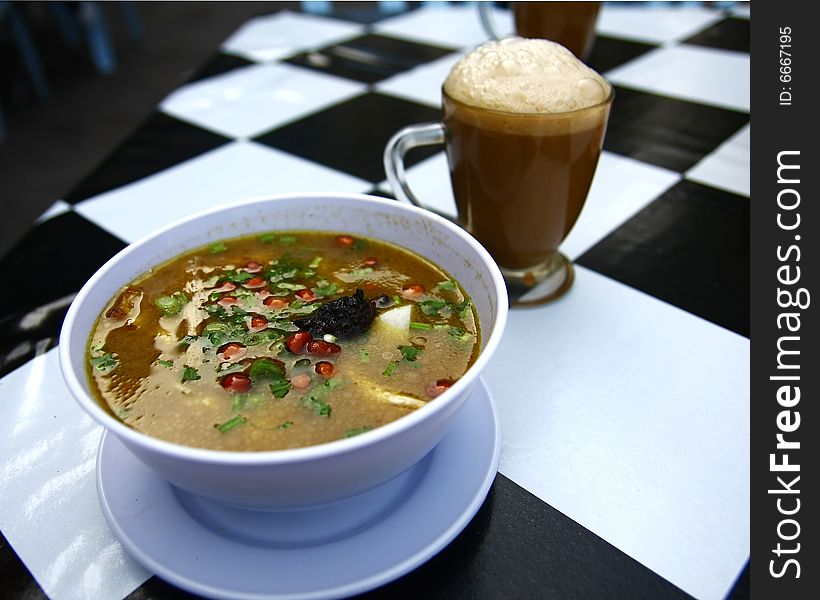 A noodle soup named 'Soto' in Malaysia with Milk Tea also known as 'Teh Tarik' among the locals. A noodle soup named 'Soto' in Malaysia with Milk Tea also known as 'Teh Tarik' among the locals.