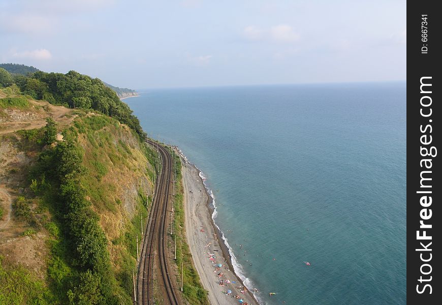 Railway and sea.