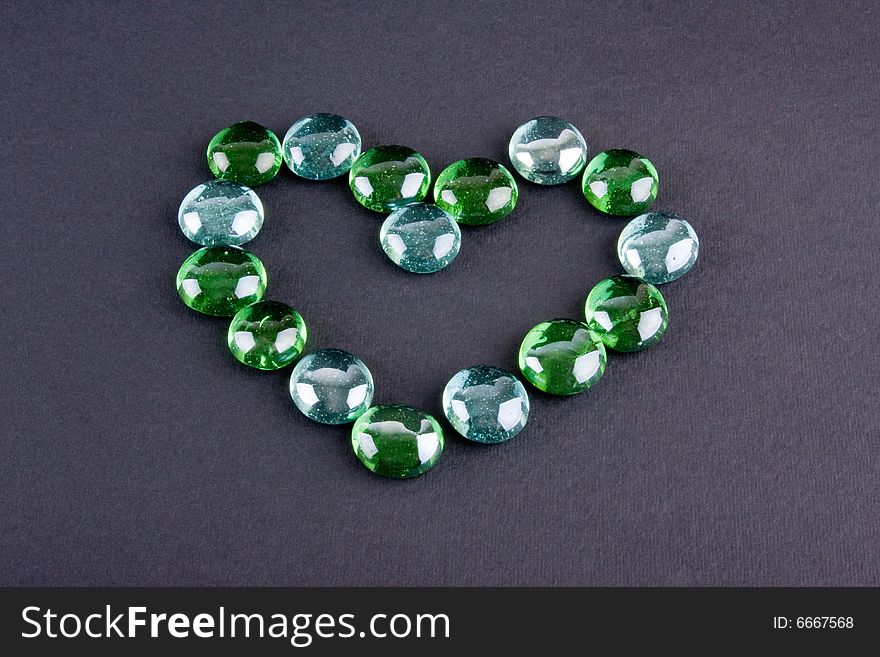 Glass stones making heart shape