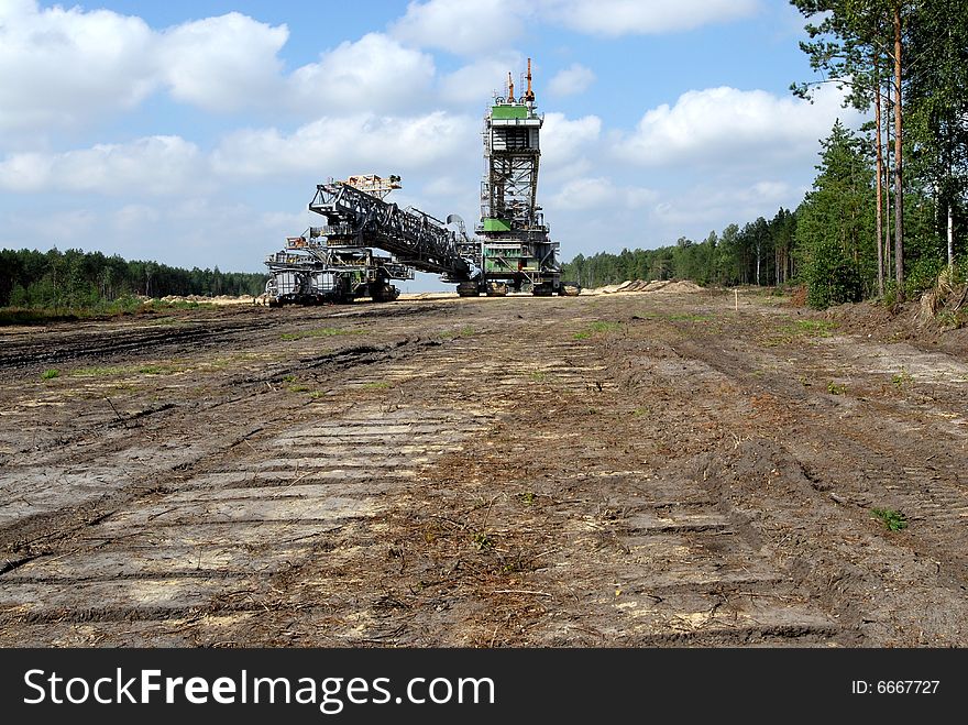 Big coal digger on it's way to new working place in coal mine.