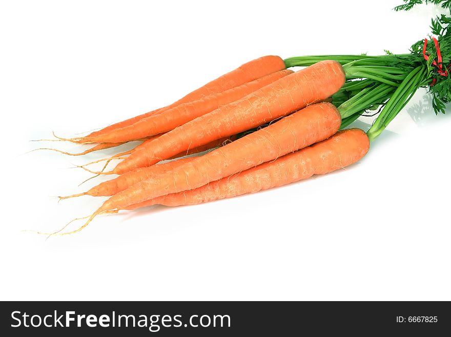 Fresh carrots on bright background