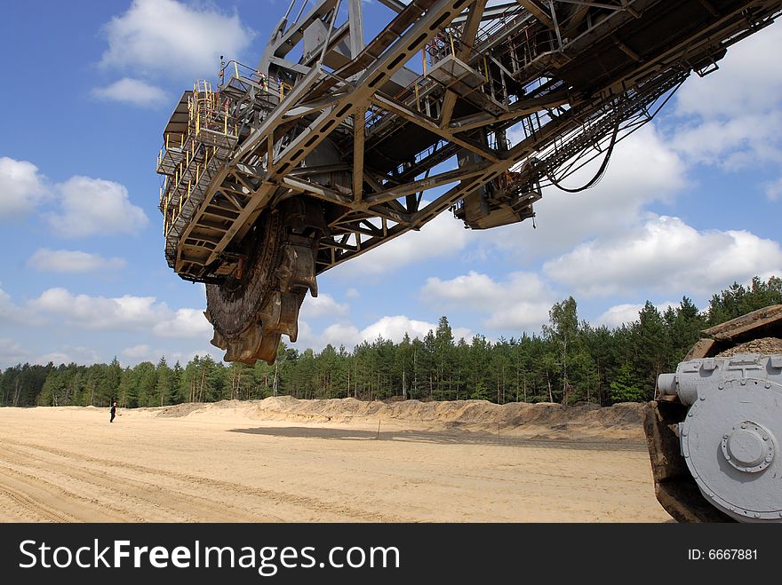 Big coal digger on it's way to new working place in coal mine.