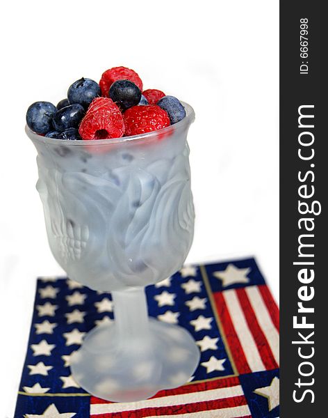 Fresh berries in a goblet on a patriotic napkin. Fresh berries in a goblet on a patriotic napkin.