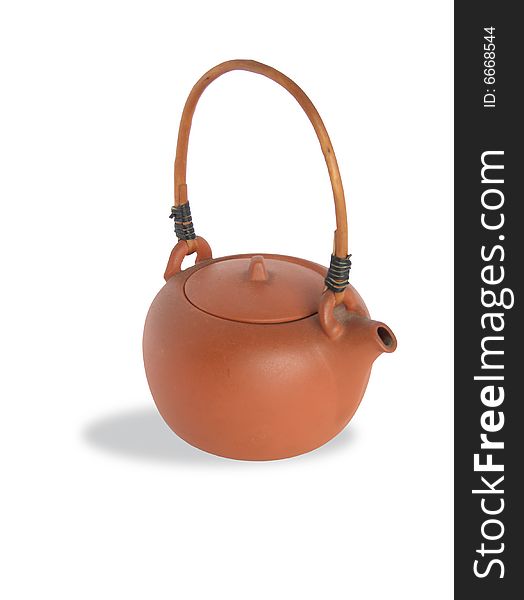 Isolated ceramic teapot with wicker wooden handle