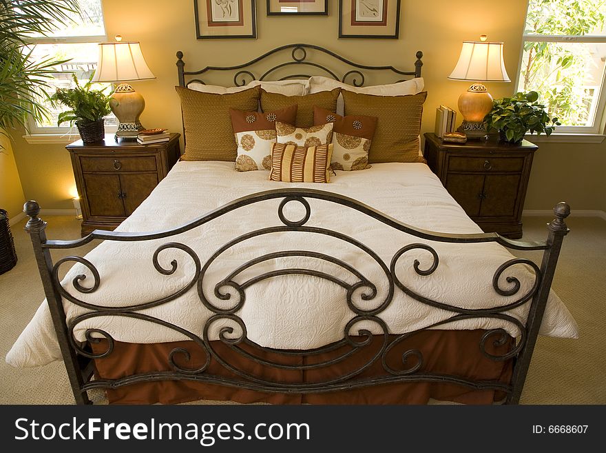 Comfortable modern designer bedroom with stylish furniture and decor. Comfortable modern designer bedroom with stylish furniture and decor.