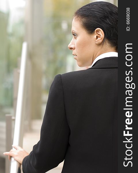 Outdoor closeup portrait of businesswoman in black