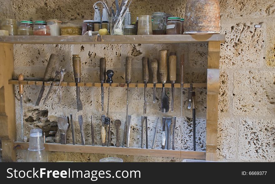 Where a sculptor works, tools in a rack. Where a sculptor works, tools in a rack.