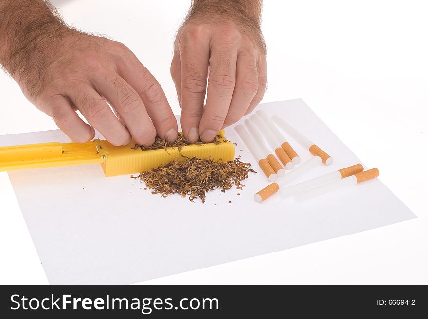 Hands Of Man Making Cigarettes