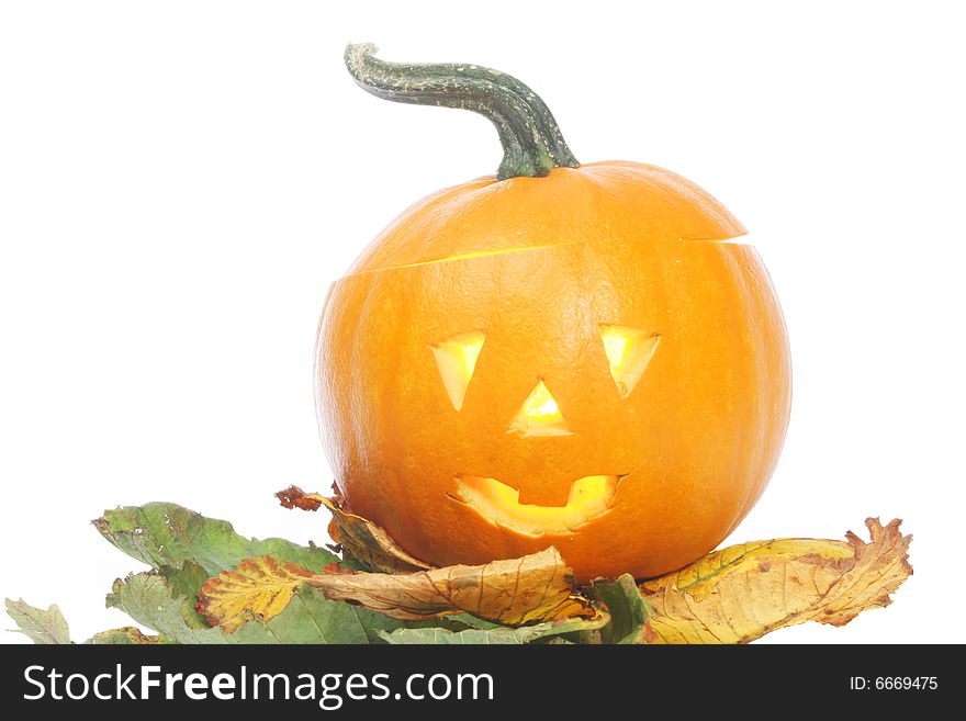 Halloween pumpkin lantern on bed of Autumn leaves. Halloween pumpkin lantern on bed of Autumn leaves