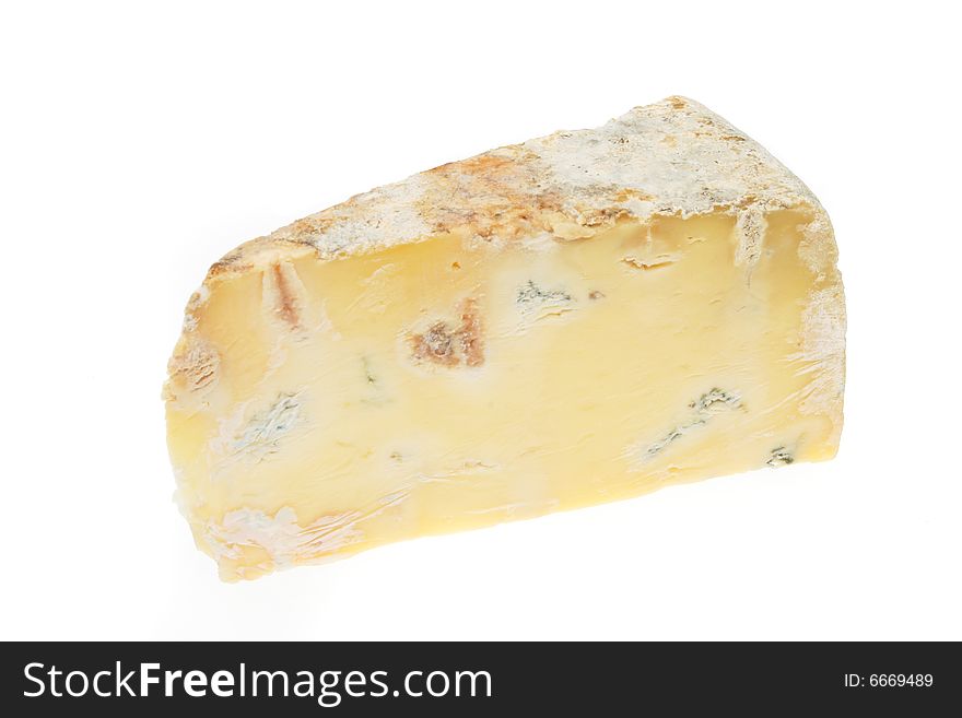 Wedge of creamy blue cheese isolated on white