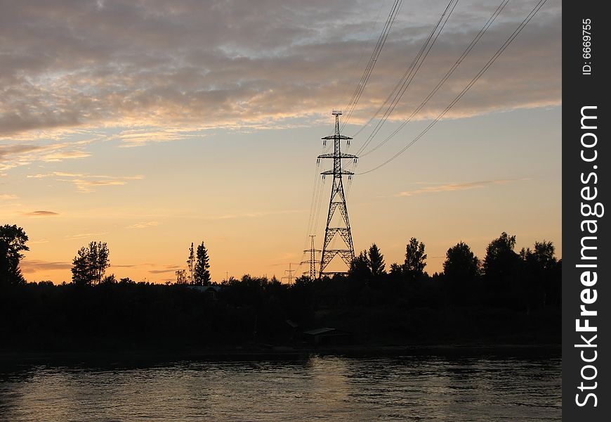 Electric power line pillar against sky. Summer day.