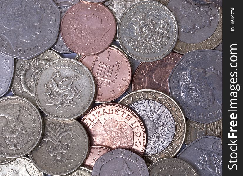 Scatter of british coins, different denominations