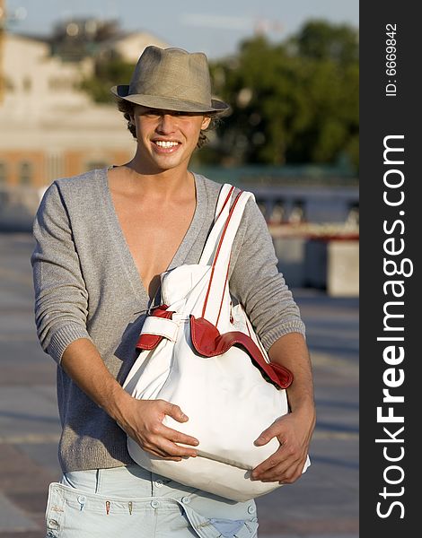 Portrait of young man with large bag for shopping. Portrait of young man with large bag for shopping