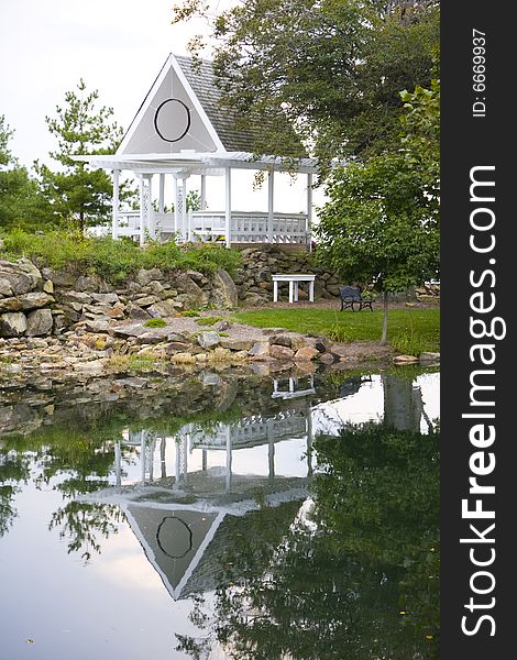 Wedding gazebo sitting on the side of a lake. Wedding gazebo sitting on the side of a lake