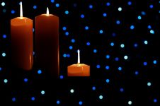 Three Large Candles Lit Amongst Blue Lights Royalty Free Stock Photos Three Large Candles Lit Amongst Blue Lights Royalty Free Stock Photos