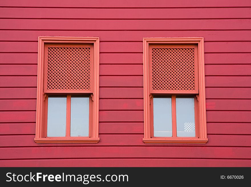 Red windows of red old house. Red windows of red old house.
