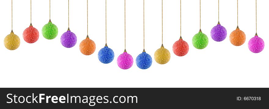 Colored christmas balls in different positions on white background