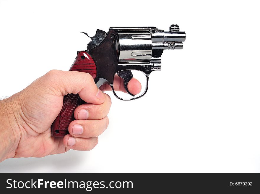Hand holding a revolver on white background. Hand holding a revolver on white background