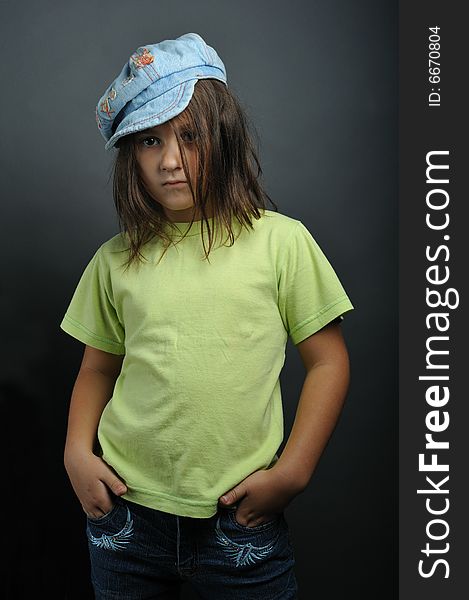 Portrait of a little girl on grey background. Portrait of a little girl on grey background