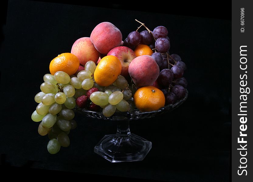 Fresh fruits on black background