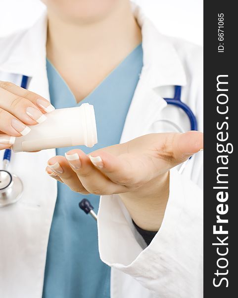 Close up of doctor holding a bottle of pills isolated on white. Close up of doctor holding a bottle of pills isolated on white