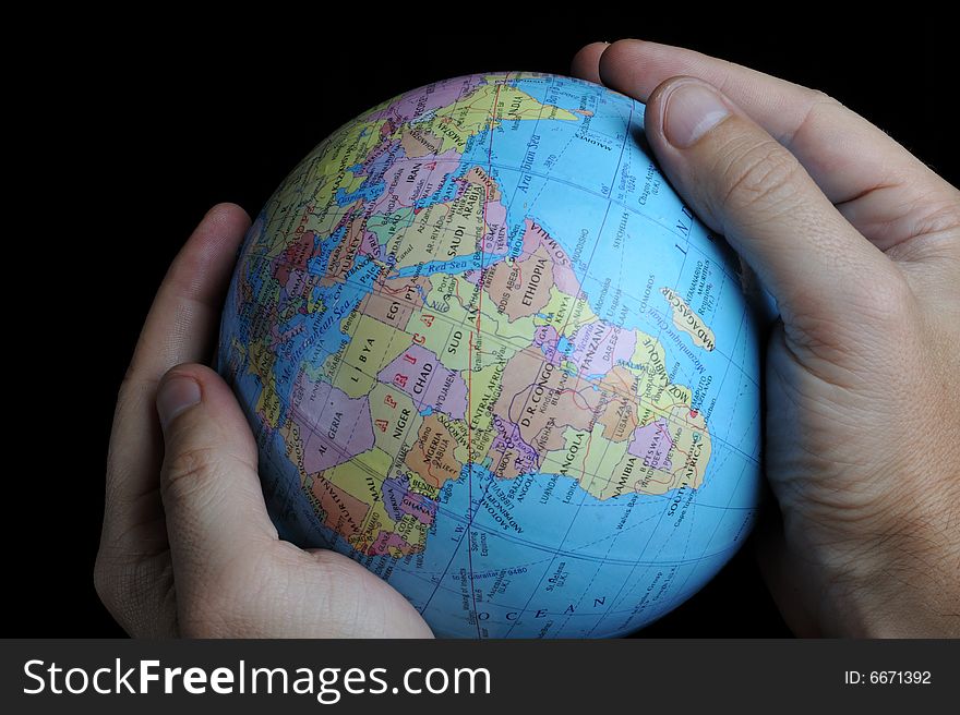 Close-up of Earth globe holded in hands. Close-up of Earth globe holded in hands