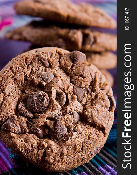 Close up of a chocolate chip cookie on a napkin