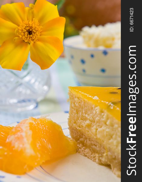 Cheesecake with fresh orange slices on a plate