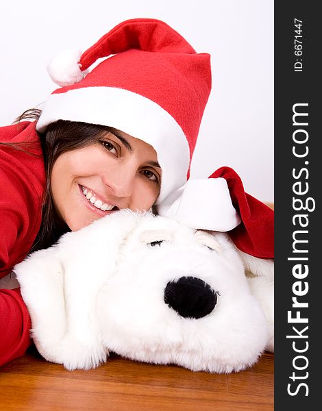 Young woman playing with toy dog in christmas - portrait orientation