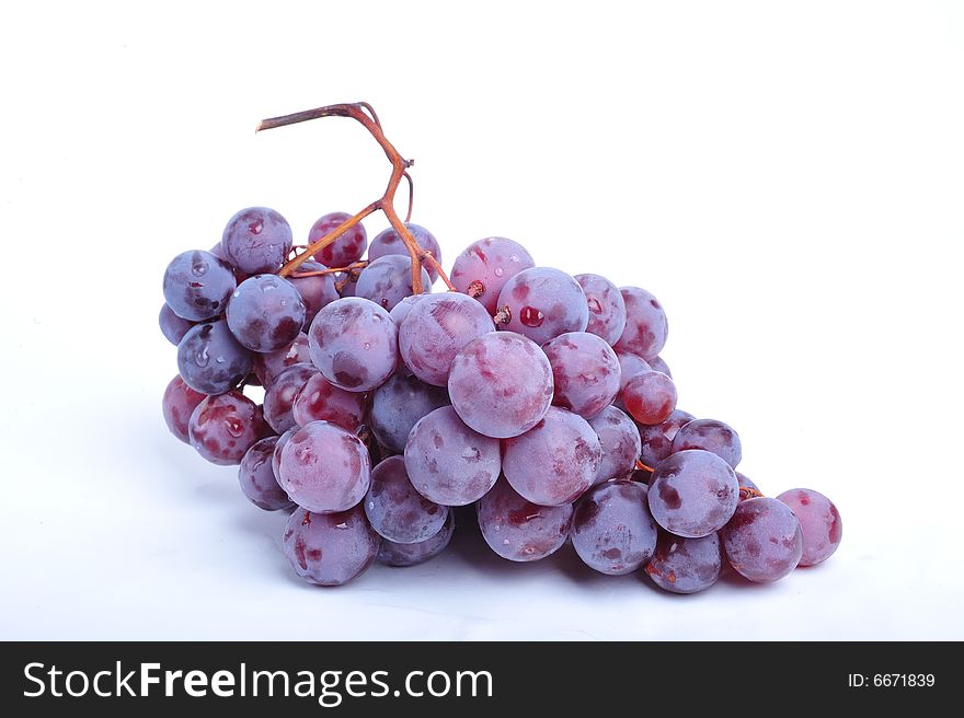 Cluster of grapes on white background - close up