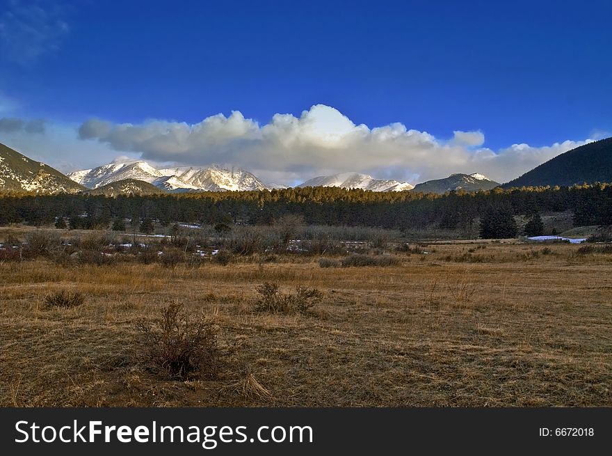 The Colorado Rocky Mountains with snow and blue sky taken in late winter. The Colorado Rocky Mountains with snow and blue sky taken in late winter