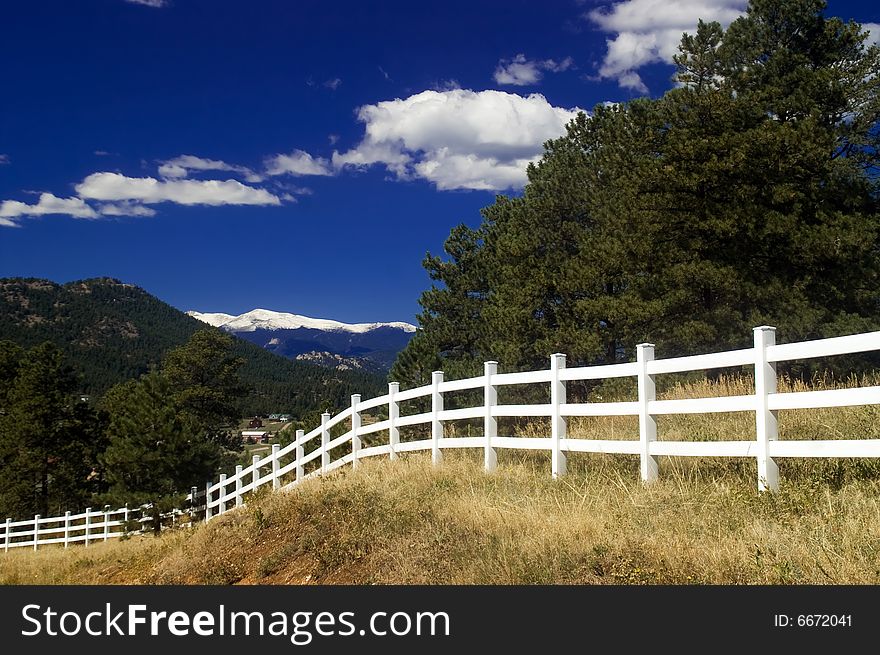 White Rural Picket Fence in Colorado