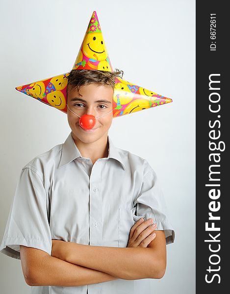 Young boy with party horn and clown noses. Young boy with party horn and clown noses