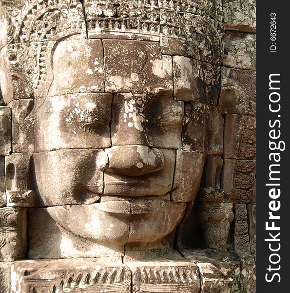 A large and peaceful face is carved into the mighty temple of Bayon, Cambodia. A large and peaceful face is carved into the mighty temple of Bayon, Cambodia.