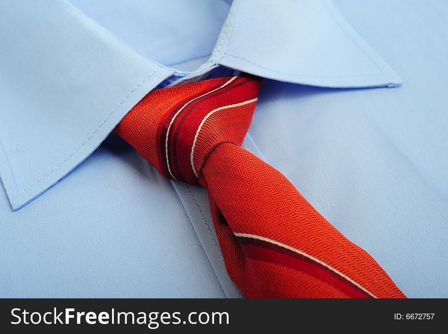 Close up of a shirt with red tie. Close up of a shirt with red tie