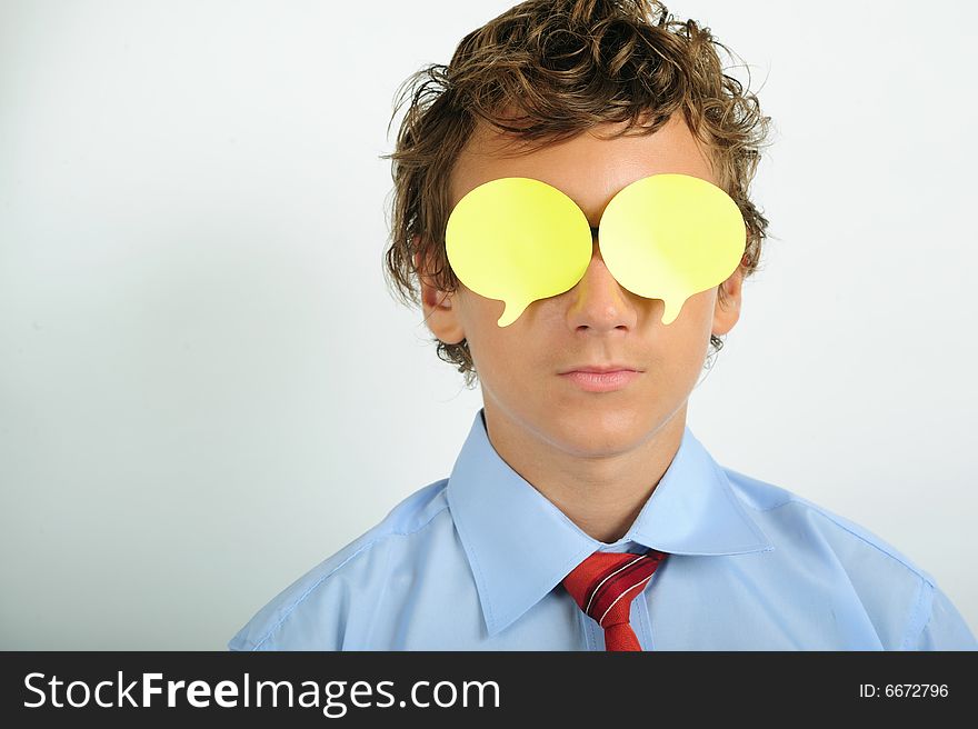 Very young business man with yellow notes on eyes. Very young business man with yellow notes on eyes