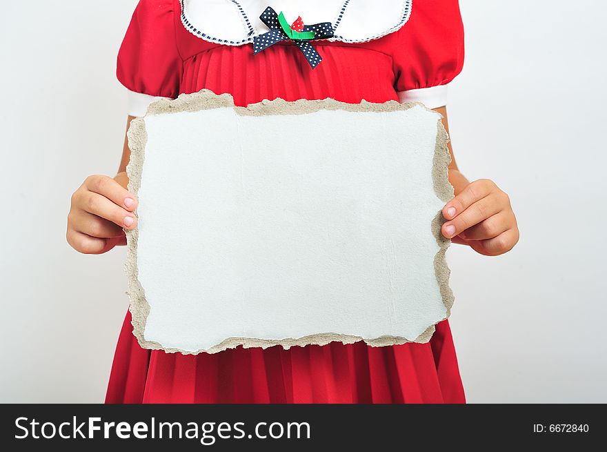 Little girl holding a blank cardboard, close up. Little girl holding a blank cardboard, close up