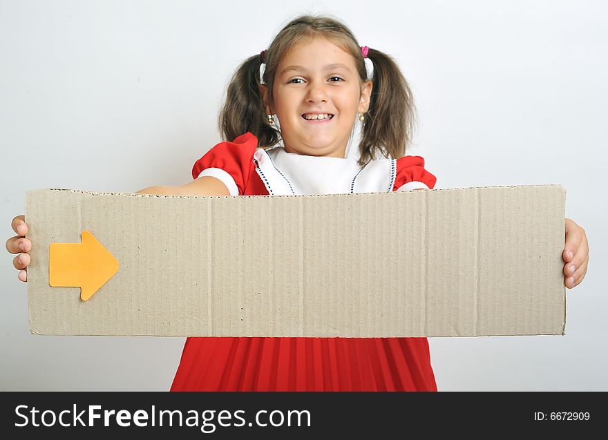 Little girl holding a blank cardboard, close up