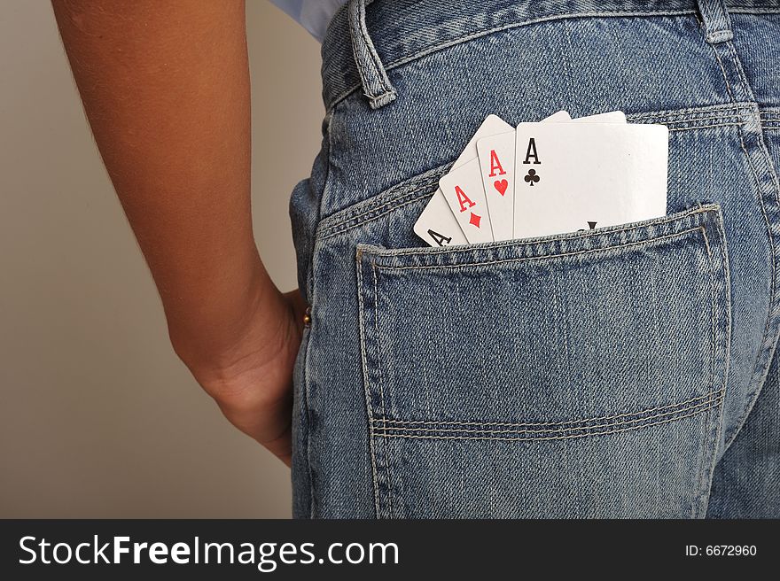 Close up of four aces in back pochet jeans