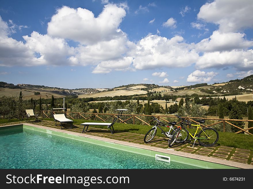 Bicycles in the garden of a luxury country house in the famous tuscan hills, Italy. Bicycles in the garden of a luxury country house in the famous tuscan hills, Italy.
