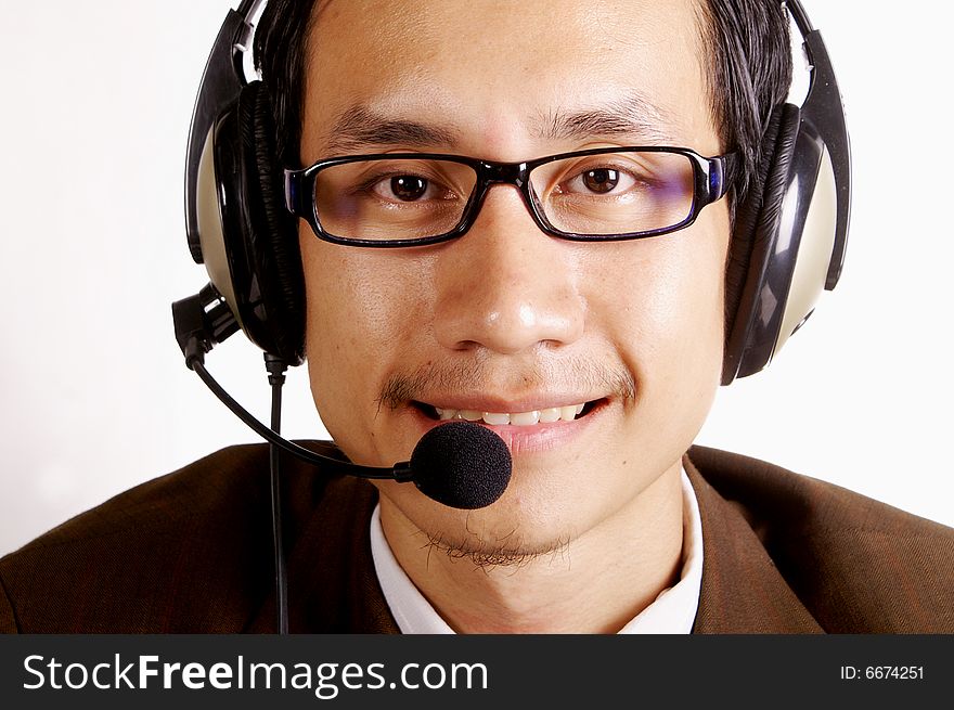 Young man operator  answer telephone smile