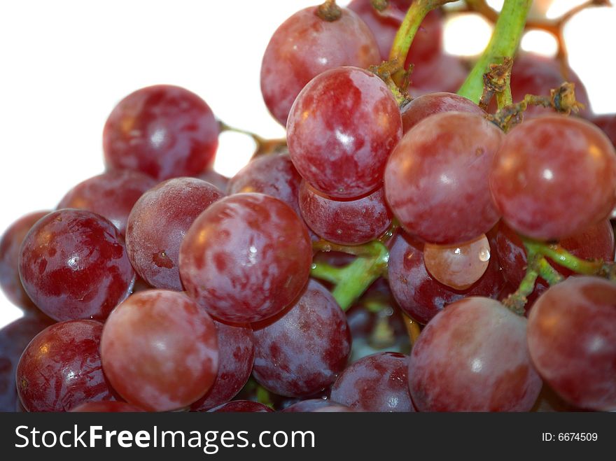 Itâ€™s close up fresh red grape on the white background. Itâ€™s close up fresh red grape on the white background.